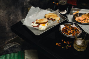 Delicious looking bar food with nuts and whiskey at Bobby's Garage in Nashville TN