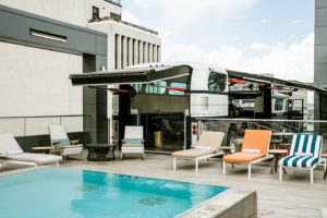 Greyhound Bus and pool deck lounge area at Rooftop Lounge at Bobby Hotel in Nashville